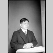 Portrait of man sitting at a table (ddr-densho-426-2004)