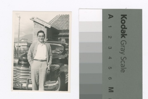 Man in front of automobile (ddr-densho-255-72)