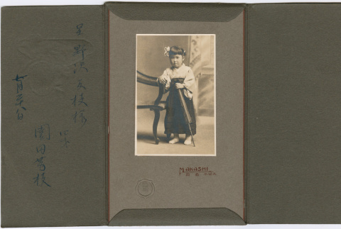 Portrait of girl in photo folder (ddr-densho-426-2429)