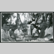 Photograph of a laughing group of people at a Manzanar hospital staff picnic (ddr-csujad-47-239)