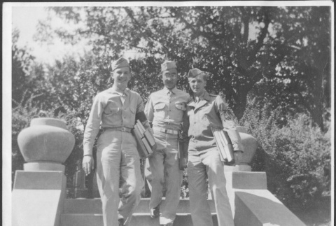 Three men on steps, William Tsuchida in center (ddr-densho-434-454)