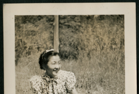 Woman poses on lawn (ddr-densho-359-292)