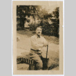 Thomas Rockrise sitting on bench (ddr-densho-335-261)