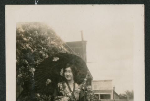 woman in a robe in a garden (ddr-densho-378-825)