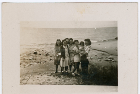 Group of women and a girl standing on beach (ddr-densho-316-189)
