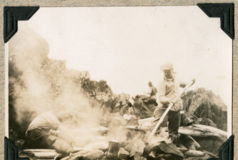 Men cooking over wood fire (ddr-densho-383-159)