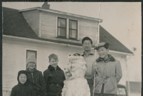 Five boys standing by snowman (ddr-densho-523-230)
