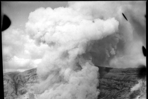 Crater of volcano steaming (ddr-densho-426-275)