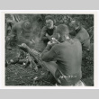 A group of Merrill's Marauders gathered around campfire (ddr-densho-1007-236)
