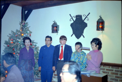 Tomoye with four others at podium (ddr-densho-426-1162)
