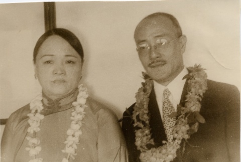 Wang Ching-ting and a woman wearing leis (ddr-njpa-1-1117)