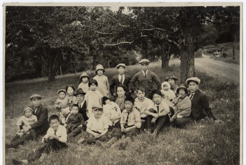 Nikkei Family in field with trees (ddr-densho-259-590)