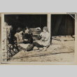 Three women smile while holding goats (ddr-densho-433-723)