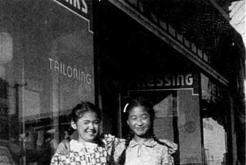 Two Nisei girls in front of dye works (ddr-densho-135-2)