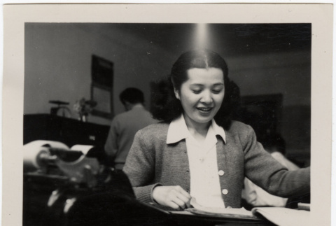 Woman seated at desk (ddr-densho-426-891)