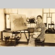 An artist posing with her painting (ddr-njpa-4-2721)