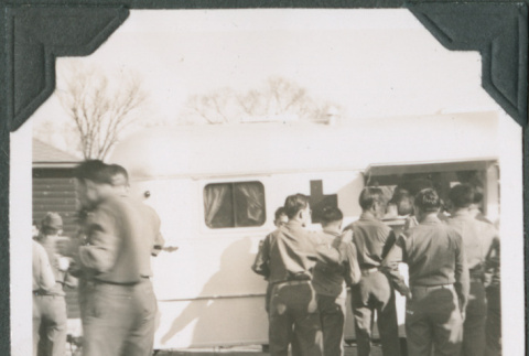 Group of men by Red Cross canteen truck (ddr-ajah-2-474)