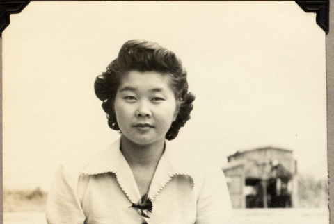 Woman sitting on lawn (ddr-densho-587-71)