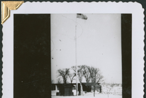 View of small huts and gate (ddr-densho-434-313)