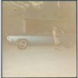 Woman holding boy next to car (ddr-densho-523-605)