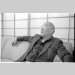 John Fujii on sofa (ddr-densho-1007-1174)