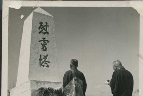 Rev. Shinjo Nagatomi performing a ceremony at the Manzanar cemetery (ddr-manz-4-248)