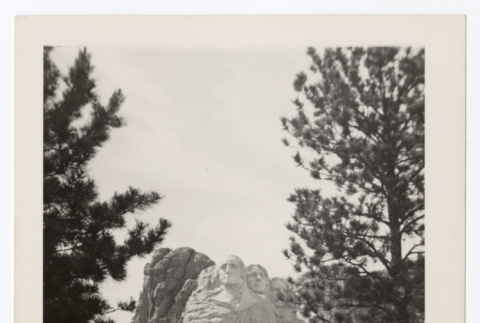 Man takes a photograph of Mount Rushmore (ddr-densho-404-418)