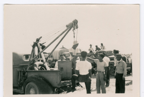 Group around crane in truck bed (ddr-densho-475-303)