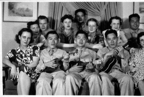 Group of people, seated with three ukuleles (ddr-densho-1007-62)