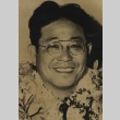 Raymond Kakuichi Oshimo wearing leis (ddr-njpa-4-1626)