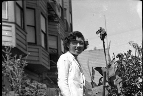 Martha (Nozawa) Tsuchida Suzuki standing in garden (ddr-densho-426-2176)