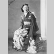 Portrait of woman in kimono with text titled: From Queen to Incarceration (ddr-ajah-6-961)