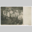 Group of men and boys seated outdoors (ddr-densho-383-418)