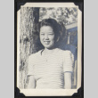 Smiling woman wearing a locket (ddr-densho-542-748)