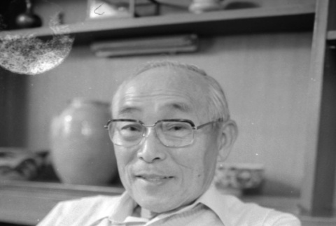 Portrait of man in white sweater (ddr-densho-1007-573)