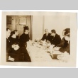 A group of men seated at a table (ddr-njpa-6-3)