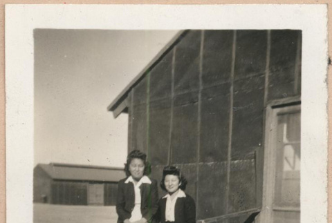 Two women on a barracks porch (ddr-manz-10-42)