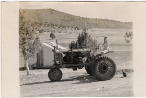 Girl on tractor (ddr-densho-426-55)