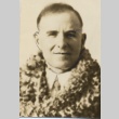Man wearing leis (ddr-njpa-2-923)