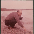 Chester Sakura Sr on rocky shoreline (ddr-densho-523-448)