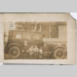 Man, woman and three children sitting on running board of car (ddr-densho-293-100)