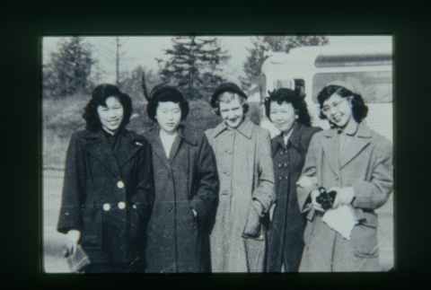 (Slide) - Image of five women in coats in front of bus (ddr-densho-330-134-master-451da77aab)