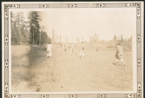 People running in field (ddr-densho-316-262)