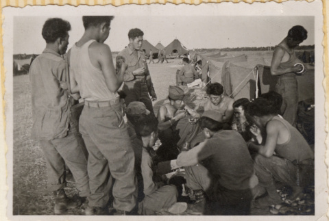 Group eating together outside a tent (ddr-densho-466-380)