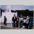 Three people standing by fountain (ddr-densho-422-588)