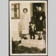 Three women and child on steps (ddr-densho-316-391)