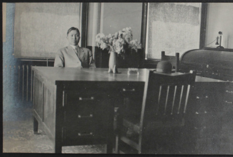 Man seated at desk (ddr-densho-355-608)
