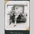 Two men leaning on truck (ddr-densho-434-190)