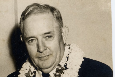 A man wearing leis (ddr-njpa-1-1242)