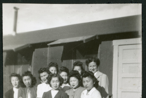 Photograph of hospital staff standing in front of the Manzanar hospital (ddr-csujad-47-254)